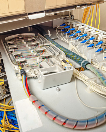 internal wiring of the optical patch panel in the wall cabinet for signal transmission via optical cablesの写真素材