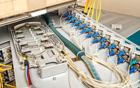 internal wiring of the optical patch panel in the wall cabinet for signal transmission via optical cablesの写真素材