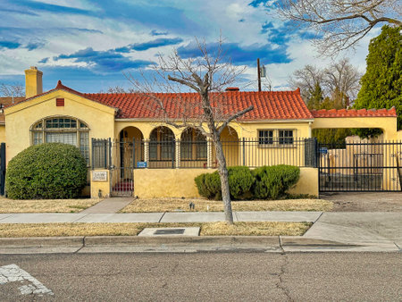 ALBUQUERQUE, NEW MEXICO, USA - March 8, 2023. Yellow old building with tiled roof. Office premisesのeditorial素材