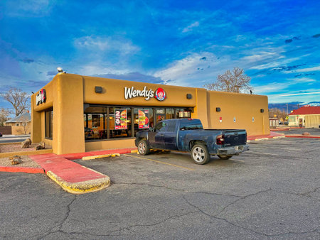 ALBUQUERQUE, NEW MEXICO, USA - March 8, 2023. Wendy's Kids Cafe. Car near entranceのeditorial素材