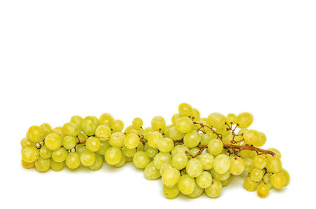 Juicy bunch of green grapes on white background. Isolated. Copy space. Vitamin diet for weight lossの写真素材