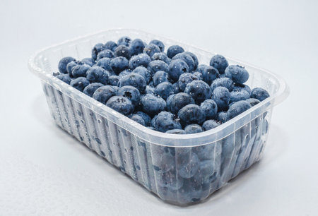 Side view box with fresh blueberries isolated on white. Concept of healthy eating. Weight lossの写真素材