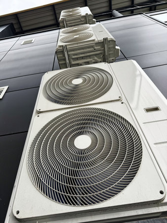 Air conditioning units attached to industrial building with steel structureの写真素材