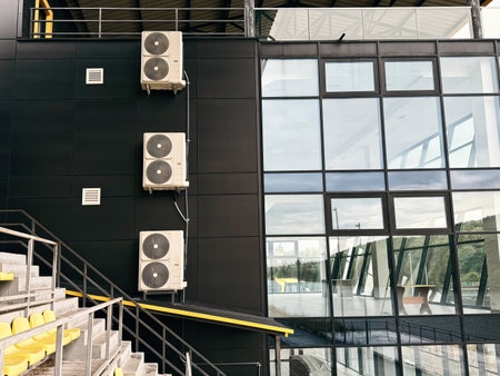 Sports building with air conditioners on the wallの写真素材
