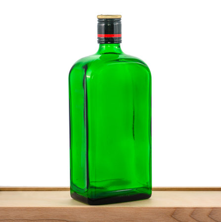 Green glass bottle on white background, minimalist and clean look, perfect for product presentation. Isolated, sharp focus, sleek designの写真素材
