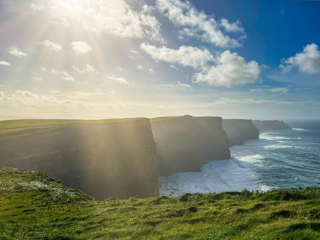 Serene coastline of Ireland with rocky shore and endless blue ocean view, rugged natural landscape meets the horizon in Ireland coastalの写真素材