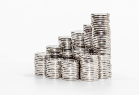 Stack of coins in row, stacked in pyramid. All coins silver and same size. Finance and savings backgroundの写真素材