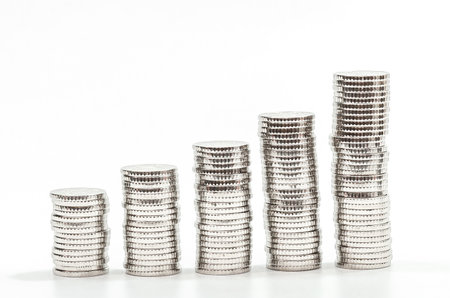 Silver coins chart on white background. Concept of growth finance, business, savings, deposit rateの写真素材