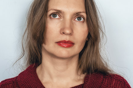 Cropped close-up mature woman's face, wrinkles around eyes. Natural beauty, skin care product advertisingの写真素材