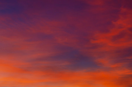 Sunset in bright colors. Orange-red-purple hues of the sky before evening. Sunset wallpaper, screensaverの写真素材