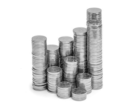 Columns of silver coins. Isolated on white. Idea of development and growth business and financeの写真素材
