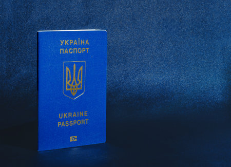 Ukrainian passport on dark blue background. Passport of a citizen of Ukraine in macro. Copy spaceの写真素材