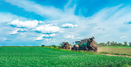 Liquid manure spreader, tractor with tank that can spray liquid manure into the soil for optimal nutrient placement. sky backgroundの写真素材