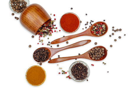 Top view of composition of spices in bowls and spoons. Colorful seasonings and spices for cooking. Indian and Asian spices on white background. Culinary site.の写真素材