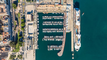 Aerial view of port of Cartagena, Spain. Large cruise ship and moored small boats on background of turquoise water. Travel and vacation concept.の写真素材