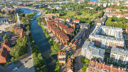 Aerial panoramic view of historic old town of Gdansk with colorful buildings, riverside architecture...