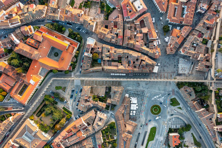 Aerial top-down view of historic center of Segovia with medieval streets, stone buildings, central square and urban patterns. Spainの写真素材