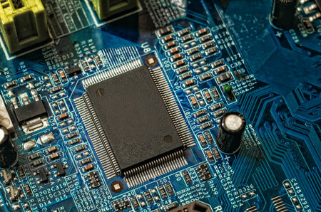 Macro close-up of central microchip mounted on computer motherboard. Detailed view of electronic...