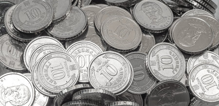 Scattered coins background symbolizing money saving, financial planning and long-term investment....