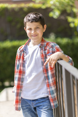 portrait of a casual teen boy, outdoorsの写真素材