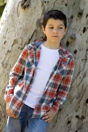 portrait of a casual teen boy, outdoorsの写真素材