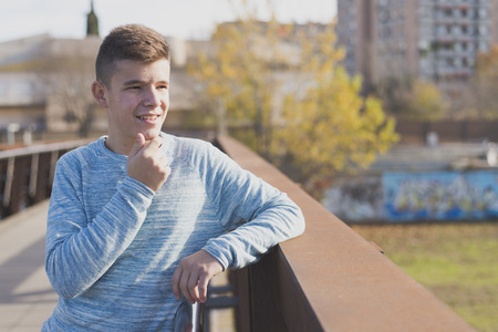 Portrait of Handsome teenage boy outdoorsの写真素材
