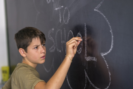 Young teen and blackboard with " back to school " written . Education conceptの写真素材