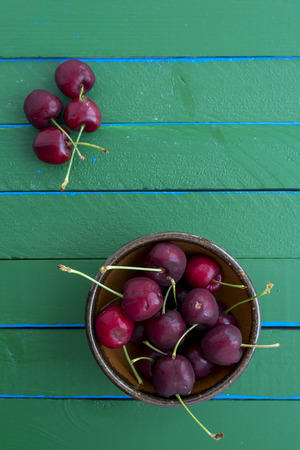 Ripe cherries on wooden table. View from above with copy spaceの写真素材
