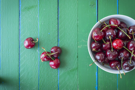 Ripe cherries on wooden table. View from above with copy spaceの写真素材