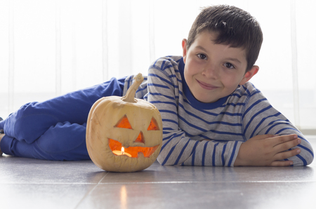 Cute boy with pumpkin in Halloweenの写真素材