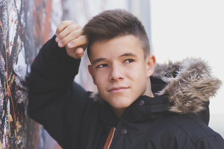 Portrait of Handsome teenage boy outdoors wearing casual clothesの写真素材