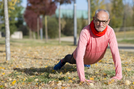 Senior Man Exercising In Parkの写真素材
