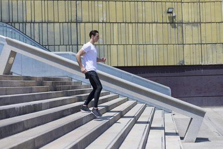 Muscular man working out in the city