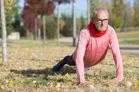 Senior Man Exercising In Parkの写真素材