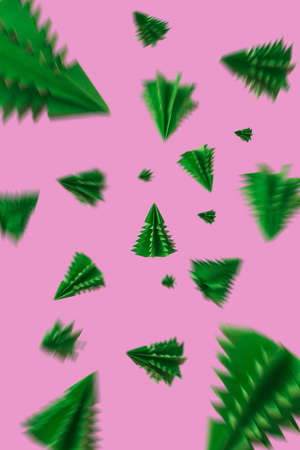 Paper Christmas trees flying or levitate on purple pink background. Creative abstract idea of New Years eve. Minimal air concept.の写真素材