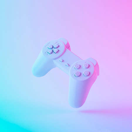 Vintage game joystick or joypad in vibrant bold gradient purple and blue holographic colors. Concept...