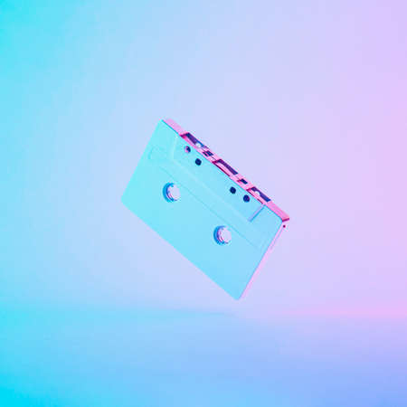 Retro wave or synthwave neon cassette type. Futuristic music creative idea. Cyberpunk with purple...