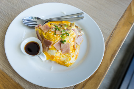 Rice covered by omelette with ham. Japanese food.の写真素材