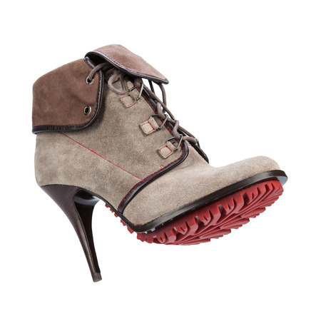 women winter boots with soles shot on a white backgrounの写真素材