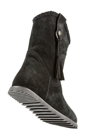 fur women winter boots with soles shot on a white backgrounの写真素材