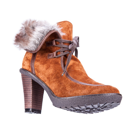fur women winter boots with soles shot on a white backgrounの写真素材