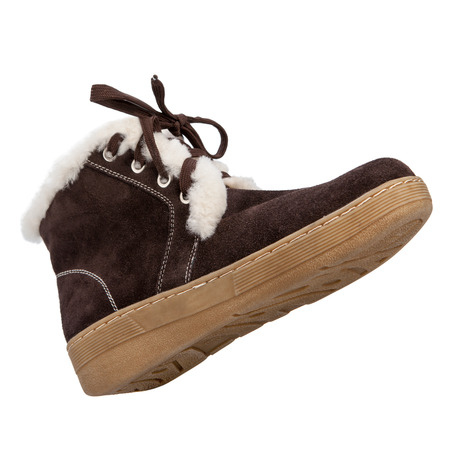 fur women winter boots with soles shot on a white backgrounの写真素材