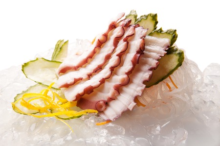 traditional Asian sushi rolls sashimi close-up shot in the studio on a white backgroundの写真素材