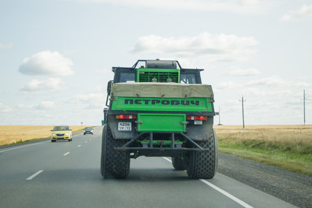 Aromashevo, Russia, September 2, 2018. Russian all-terrain vehicle on the Siberian road. The inscription on the back of the car Petrovich. This is the middle name of the driver.のeditorial素材