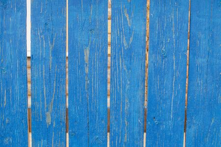 Background. Old rustic wooden fence with shabby blue paint.の写真素材