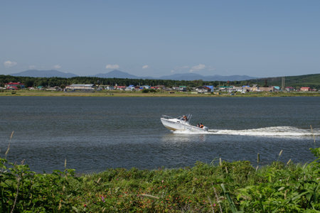 People moving on a speedboat on dustのeditorial素材