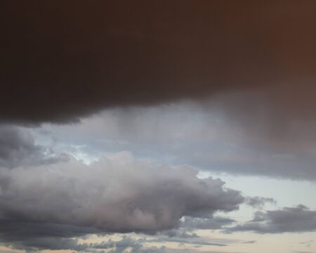 Dramatic sky before the rain with an impending black cloud. Background.の写真素材