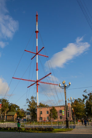 Yuzhno-Sakhalinsk, Russia - August 29, 2019. Red and white TV tower on Victory Avenue.のeditorial素材