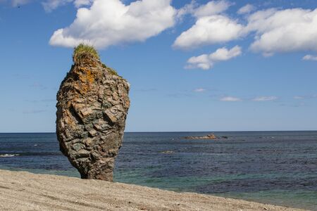 A beautiful stone outlier or rock formation on the coast of the Sea of Okhotsk. Cape Velikan, island Sakhalin , Russiaの写真素材