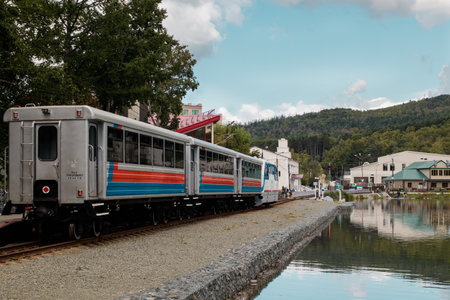 Yuzhno-Sakhalinsk, Russia - September 4, 2019: Sakhalin children's railway in the city park named after Yuri Gagarin. The train is approaching the station. Motion blur.のeditorial素材